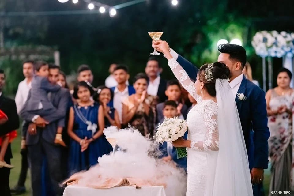 Bride and groom raising a toast at a lakeside wedding reception at Vinrich Lake Resort